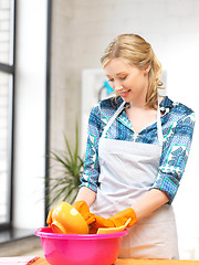 Image showing housewife washing dish at the kitchen