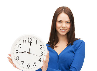 Image showing woman holding big clock