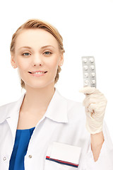 Image showing attractive female doctor with pills