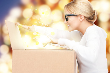 Image showing attractive businesswoman with cardboard box