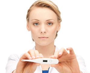 Image showing attractive female doctor with thermometer