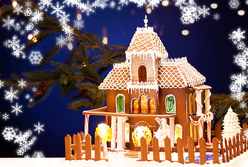 Image showing gingerbread house over christmas background