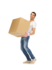 Image showing handsome man with big box