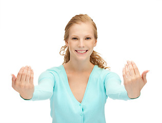 Image showing teenage girl making inviting gesture
