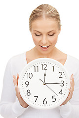 Image showing woman holding big clock