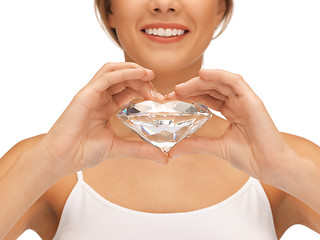 Image showing smiling woman with big diamond
