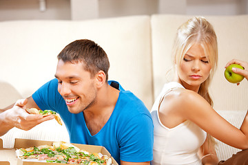 Image showing couple eating different food