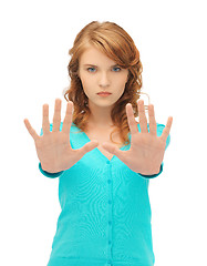 Image showing young woman making stop gesture