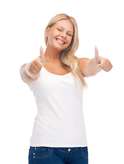 Image showing teenage girl in blank white t-shirt with thumbs up