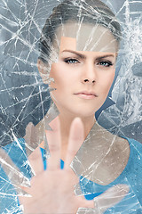 Image showing woman breaking glass