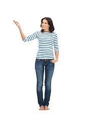 Image showing woman in casual clothes showing direction