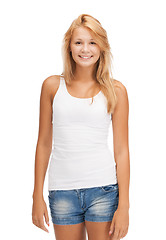 Image showing smiling teenage girl in blank white t-shirt