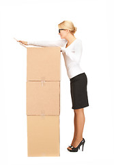 Image showing businesswoman with big boxes