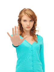 Image showing young woman making stop gesture