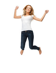 Image showing jumping teenage girl in blank white t-shirt