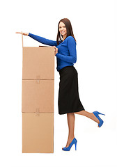 Image showing businesswoman with big boxes