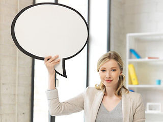 Image showing smiling businesswoman with blank text bubble