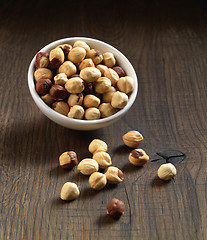 Image showing Hazelnuts on brown wooden table