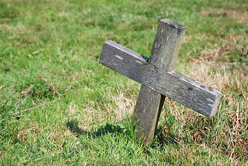 Image showing Small wooden cross in a graveyard