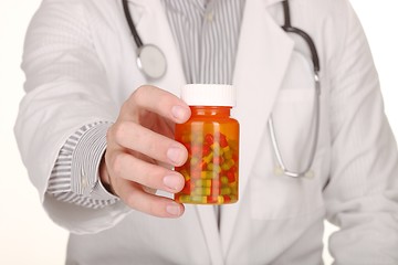 Image showing Doctor With Medication in Prescription Bottles