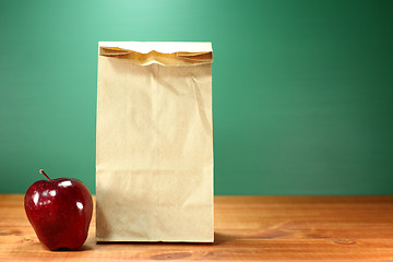 Image showing School Lunch Sack Sitting on Teacher Desk