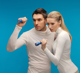 Image showing man and woman with pocket flashlights