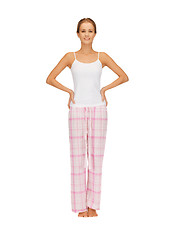 Image showing happy and smiling woman in cotton pajamas