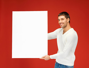 Image showing handsome man with big blank board