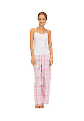 Image showing happy and smiling woman in cotton pajamas