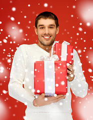 Image showing man holding many gift boxes