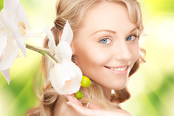 Image showing beautiful woman with orchid flower