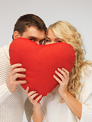 Image showing family couple in a sweaters with heart