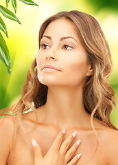 Image showing beautiful woman with green leaves