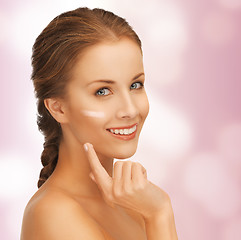 Image showing beautiful woman with moisturizing creme drop