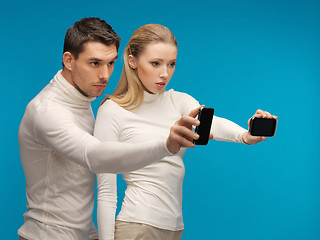 Image showing man and woman with modern gadgets