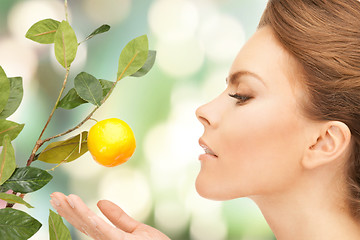 Image showing lovely woman with lemon twig