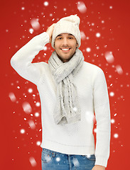 Image showing handsome man in warm sweater, hat and scarf