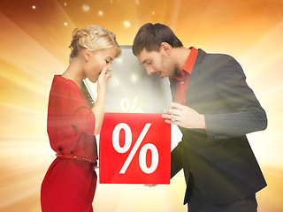 Image showing man and woman with percent sign