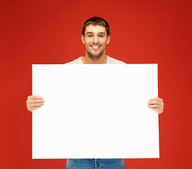 Image showing handsome man with big blank board