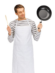 Image showing handsome man with pan and spoon