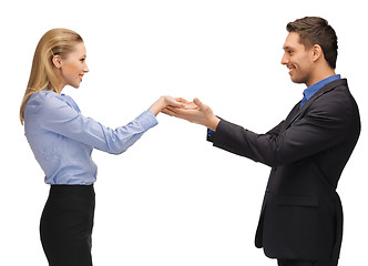 Image showing man and woman showing something on the palms