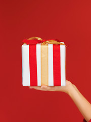 Image showing woman's hands holding a gift box