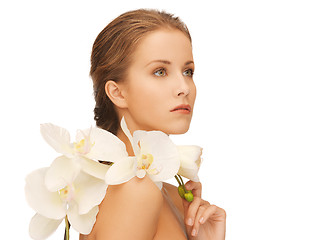 Image showing lovely woman with orchid flower