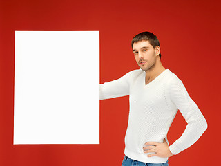 Image showing handsome man with big blank board