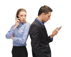 Image showing man and woman with cell phones