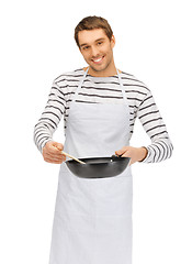 Image showing handsome man with pan and spoon