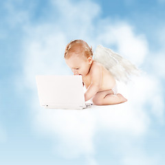 Image showing little angel with laptop computer