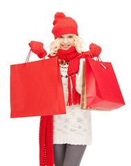 Image showing young girl with shopping bags