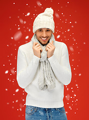 Image showing handsome man in warm sweater, hat and scarf