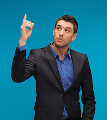 Image showing man in suit with his finger up